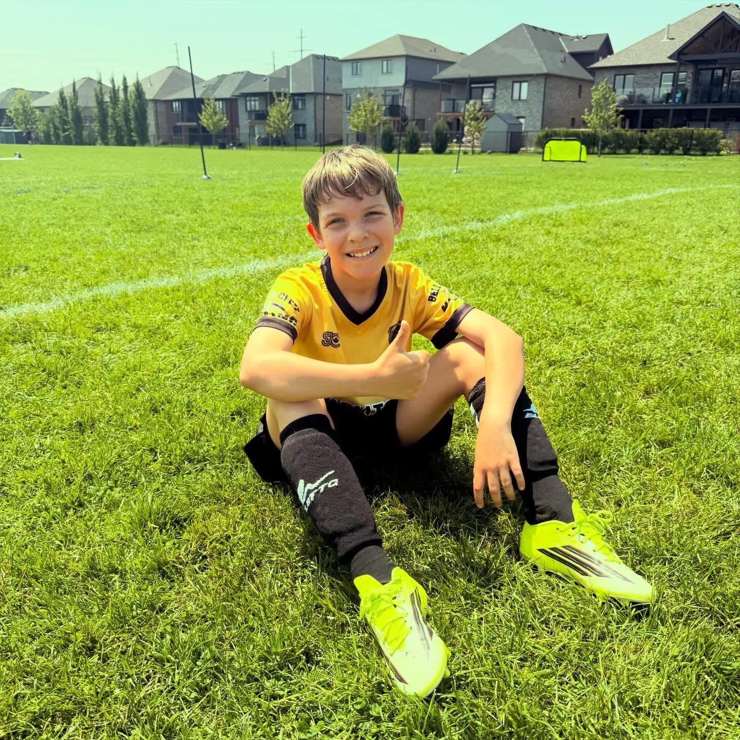 Smiling player taking a break on the grass